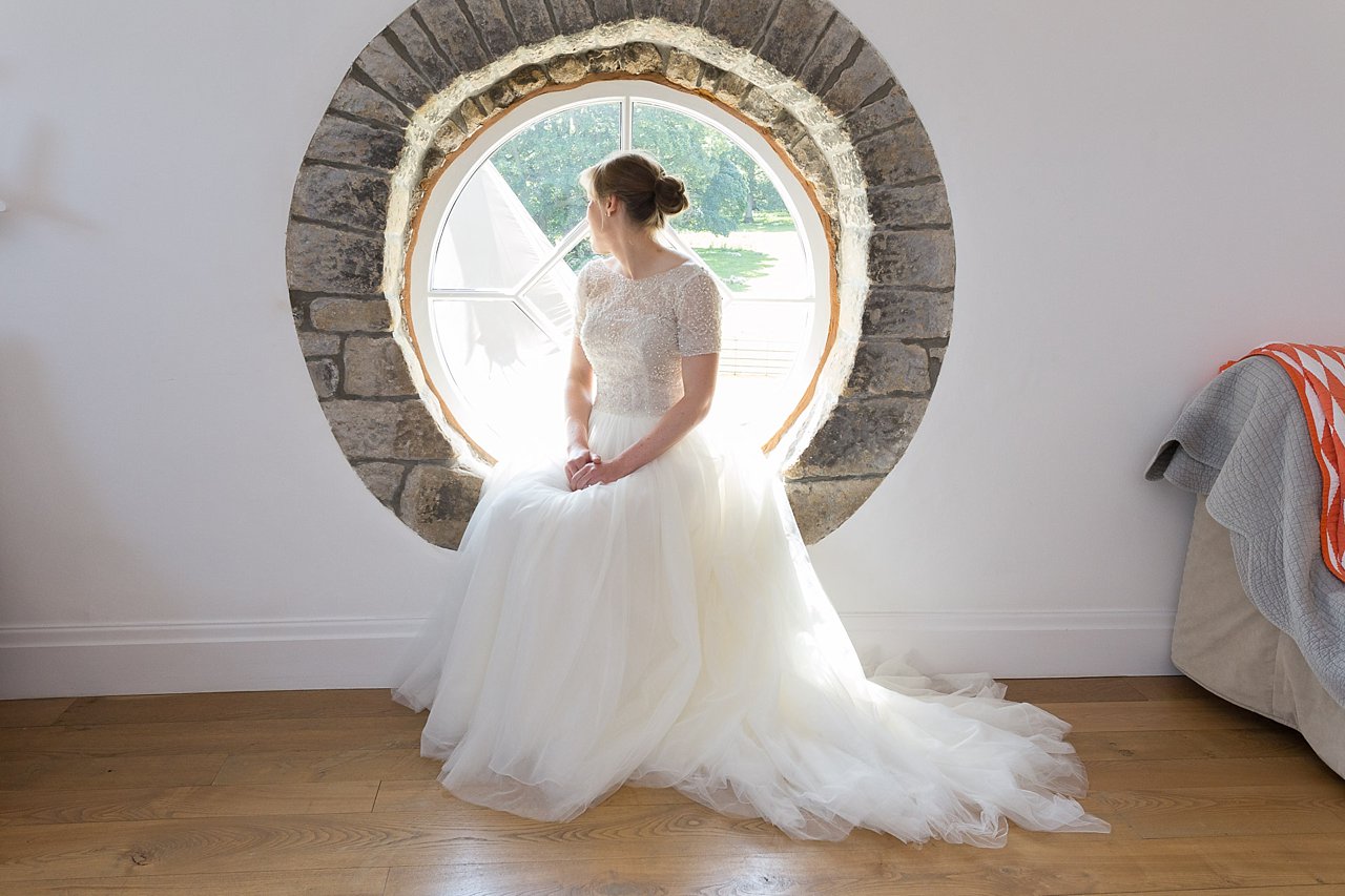 Bride sat in window